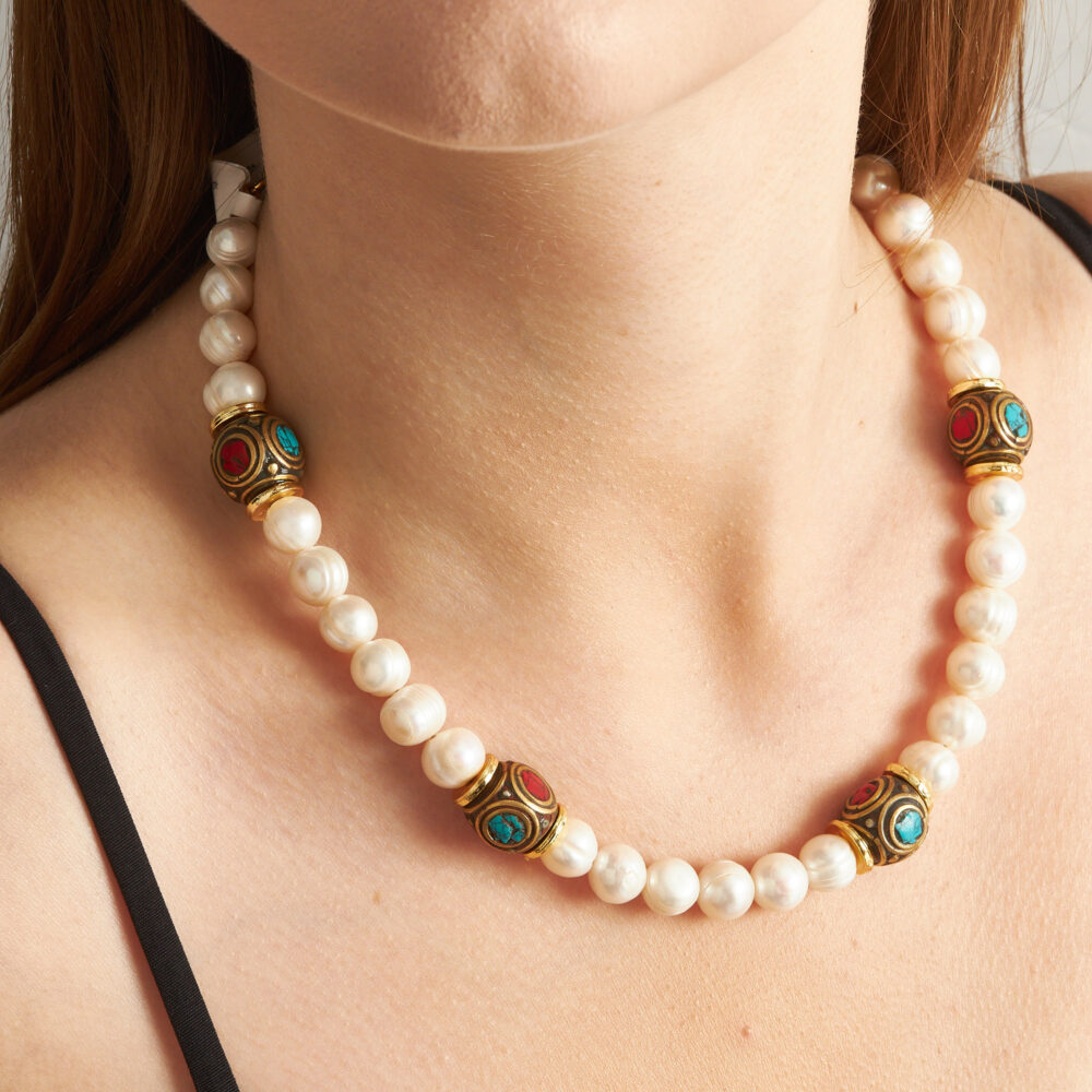 Pearl mosaic necklace with turquoise and coral accents.